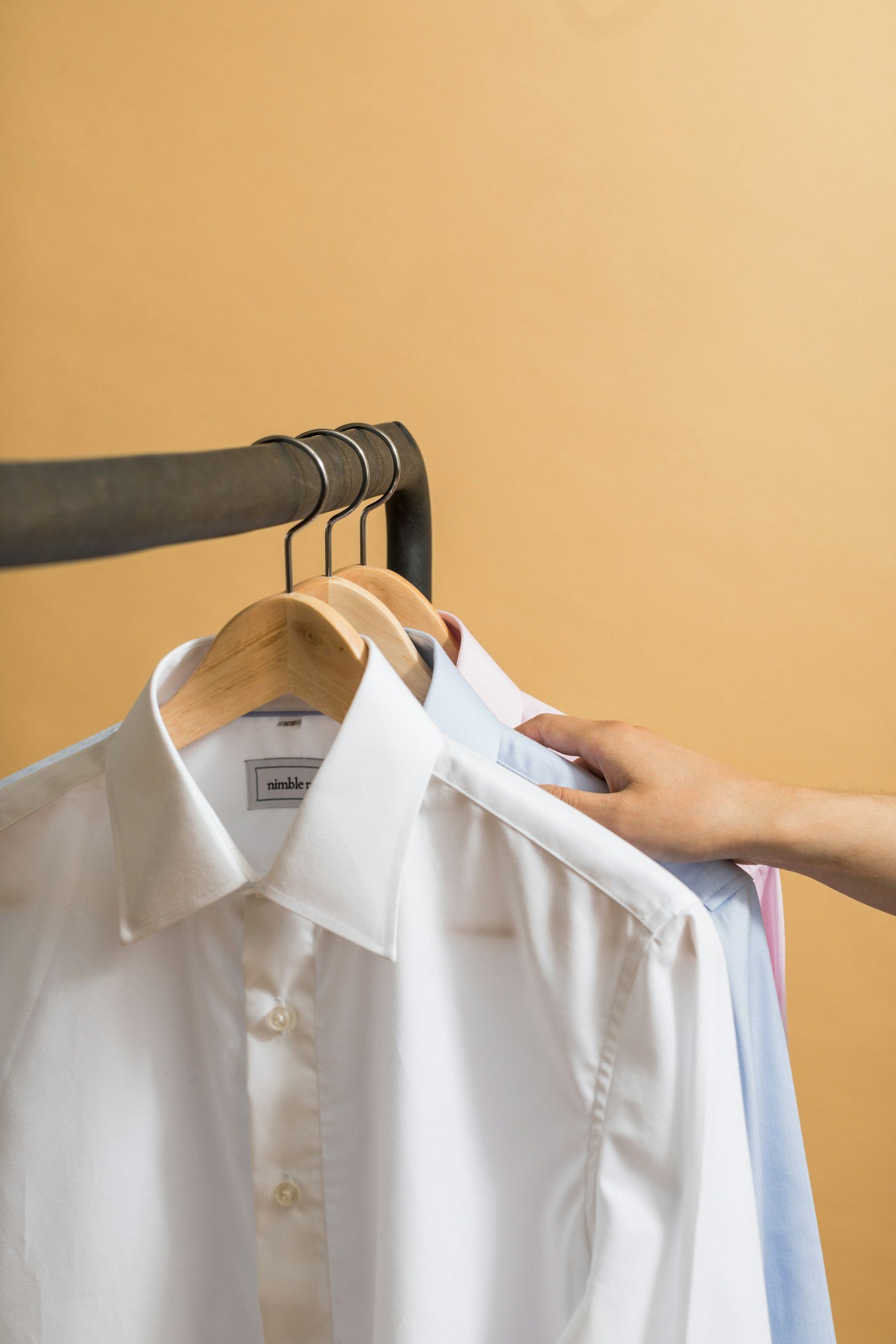 Dress shirts hanging on a rail